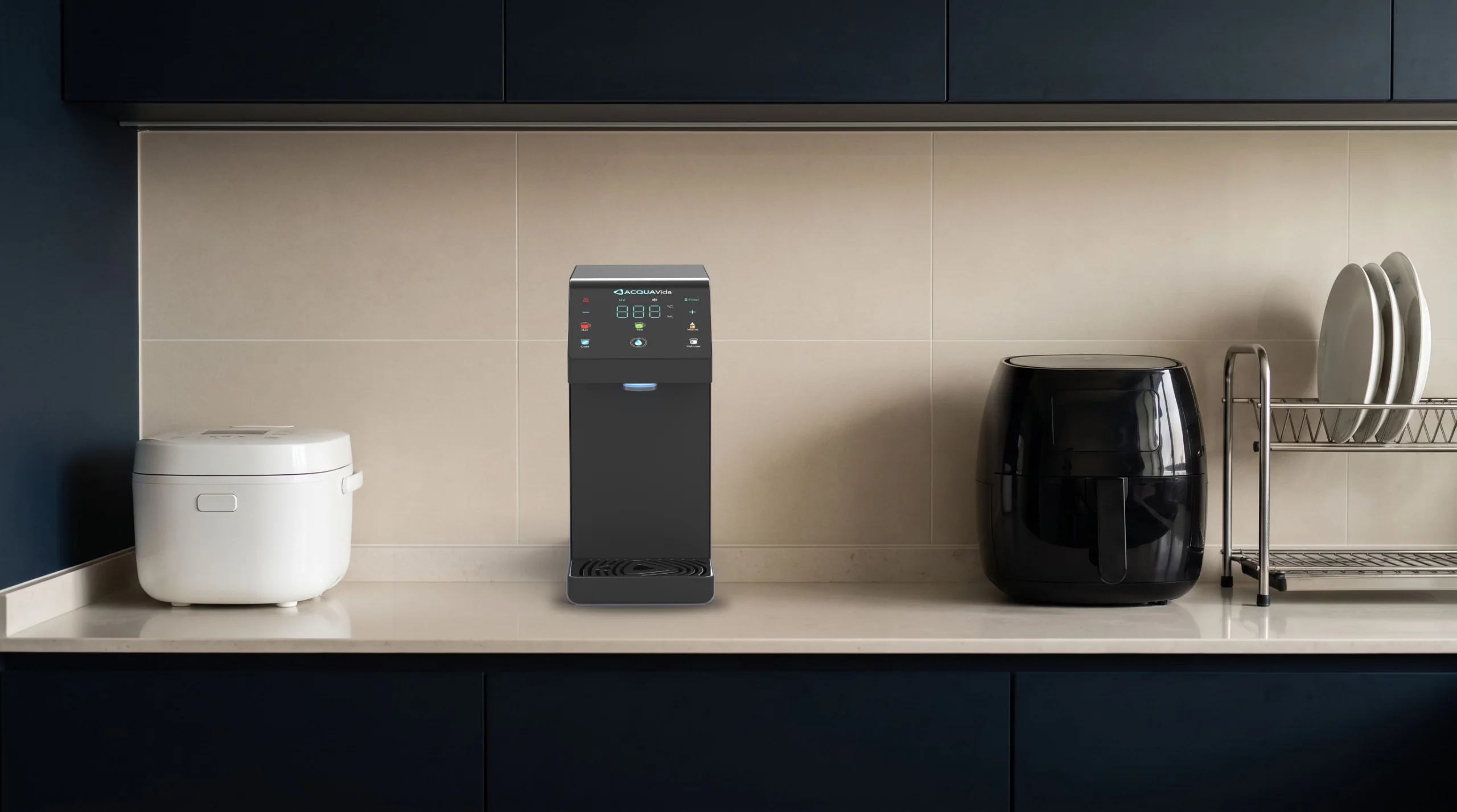 The LUNA standing on a kitchen counter between a white rice cooker and a black air fryer, with a dish rack at the end: the narrowest thing on the counter
