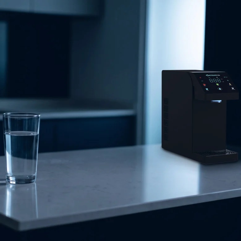 A single glass of water on the kitchen counter at midnight